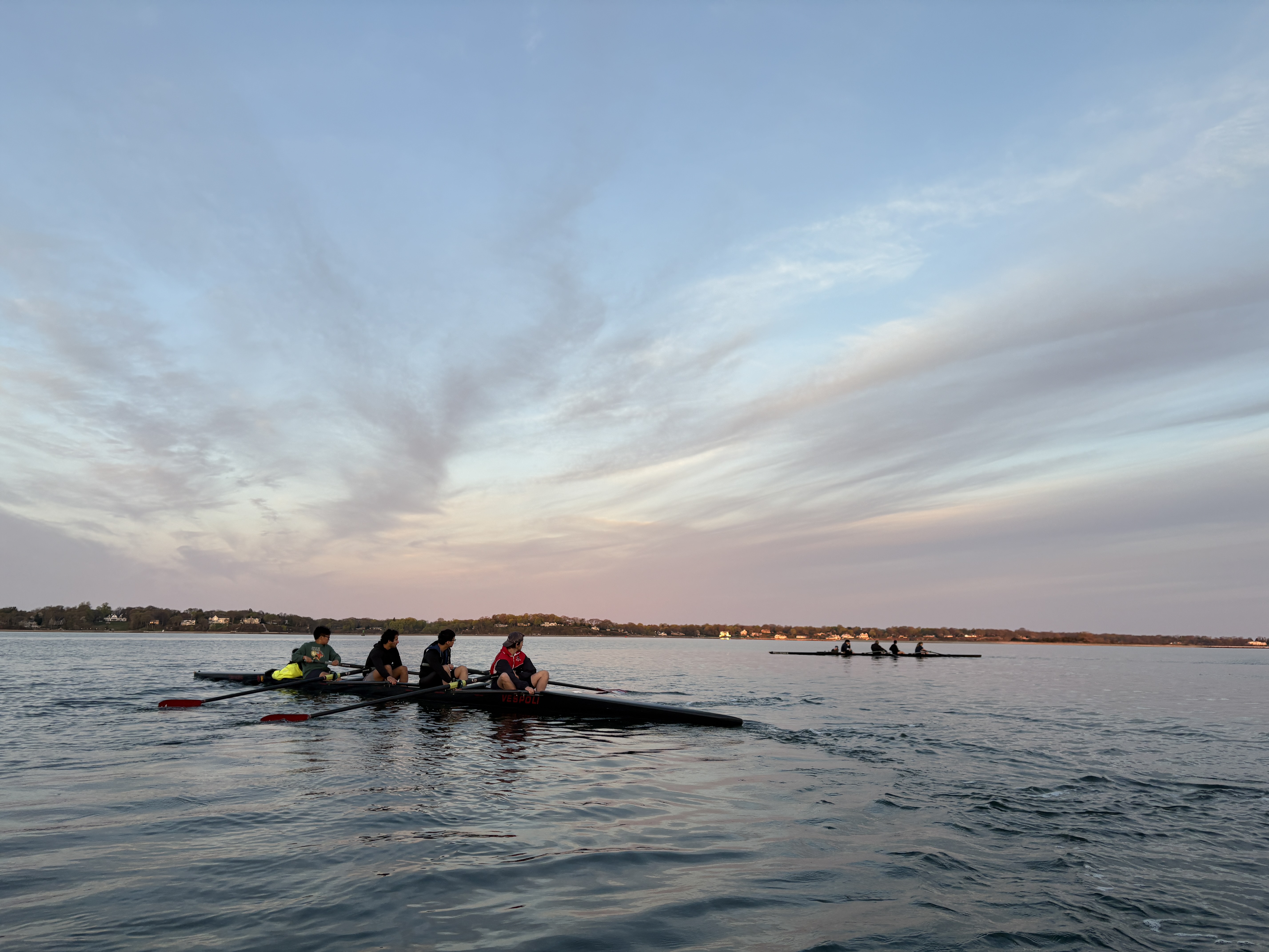 Two boats resting on the water of Port Jefferson during a practice.